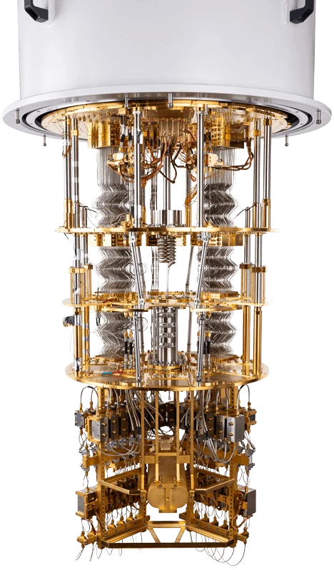 The inside of a dilution refrigerator: a tall stack of gold-plated discs and cabling suspended from a white cylinder, narrowing towards the quantum processor at the bottom.